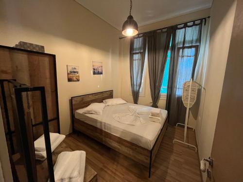 A bed or beds in a room at Thessaloniki Loxandra's House