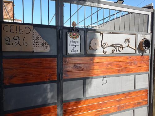 a door of a boat with signs on it at Playa, bosque y lago in Montevideo