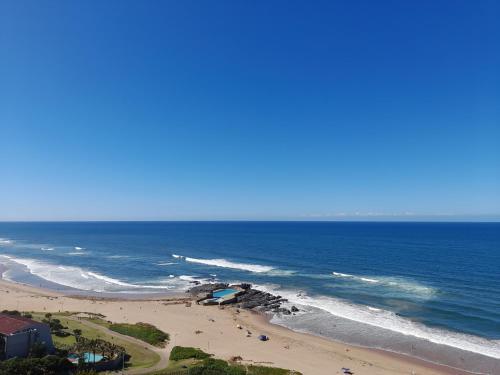 an aerial view of a beach and the ocean at Stella Maris 194 Amazimtoti Self Catering accommodation in Amanzimtoti