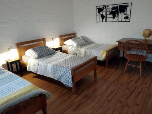 מיטה או מיטות בחדר ב-Linda y cómoda casa en Colonia del Sacramento
