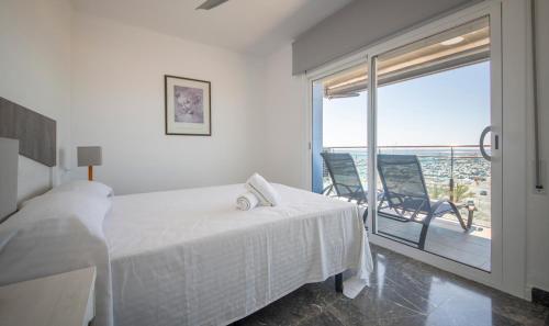 Posteľ alebo postele v izbe v ubytovaní R130 Beachfront Apartment with air conditionner