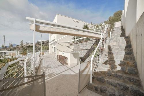 a staircase leading up to a white house at Luxurious villa in Altea Hills in Altea