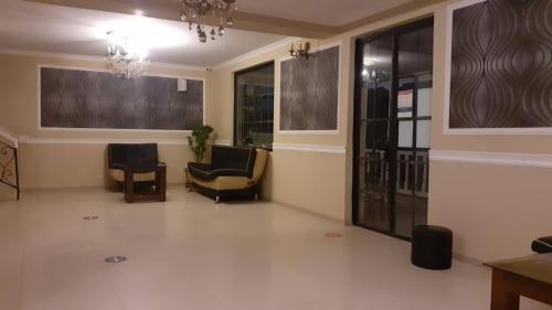 a lobby with two chairs and a waiting room at Del Mar in Ureki