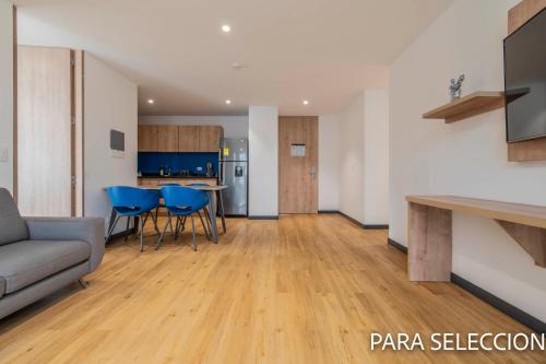 a living room with a couch and a table at CentralX 21 Bogotá in Bogotá