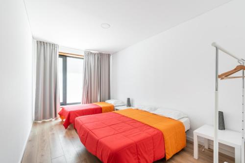 Llit o llits en una habitació de Apartamentos Do Ermal