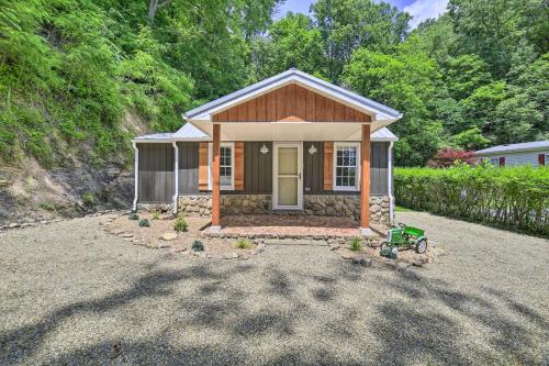 a small house in a yard with a driveway at Updated Bristol Retreat about 2 Miles to Downtown! in Bristol