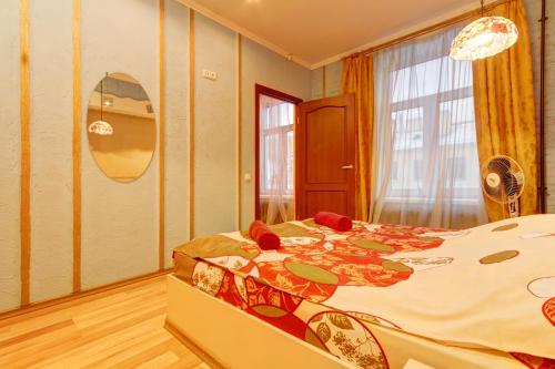 a bedroom with a large bed in a room at STN Apartments on Nevsky 60 in Saint Petersburg