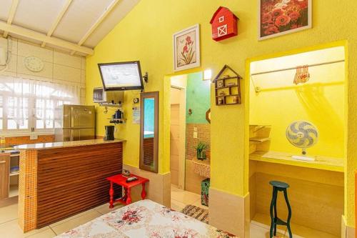 Телевизор и/или развлекательный центр в Chalés Ilhabela