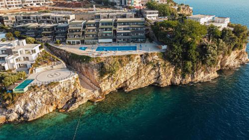 an aerial view of a resort on a cliff at Villa Amos at Aquamarine Residence in Vlorë