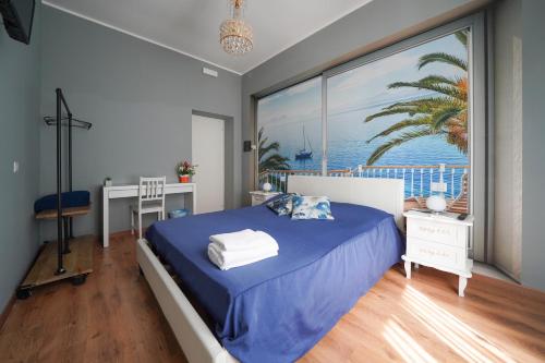 a bedroom with a blue bed and a large window at Florinda B&B in Naples