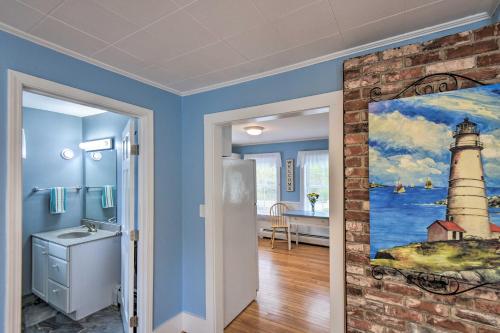 a bathroom with a painting of a lighthouse at Kennebunk Home with Yard Less Than 1 Mile to Dock Square! in Kennebunk