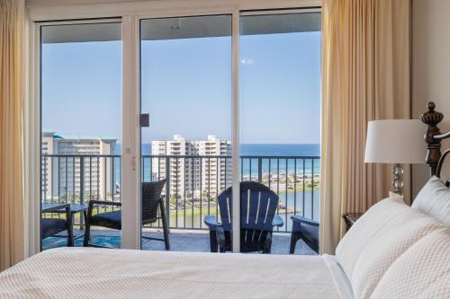 a bedroom with a bed and a view of the ocean at WS Luxury Condo of Seascape in Destin