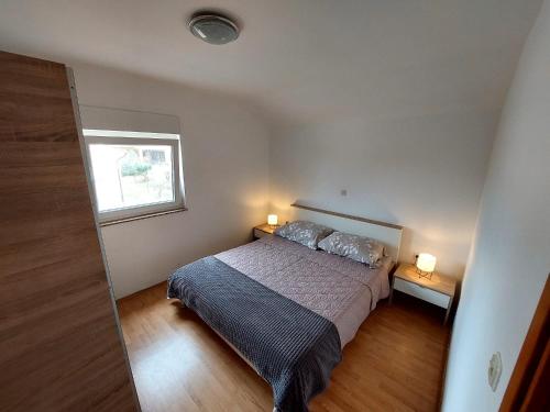 Postel nebo postele na pokoji v ubytování Apartman Željo