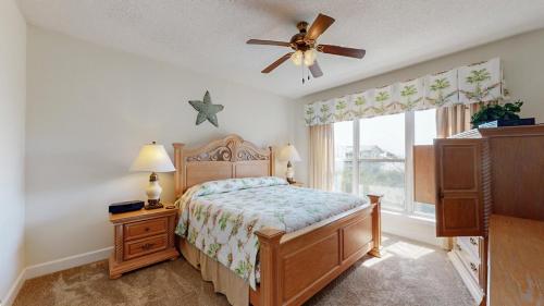 a bedroom with a bed and a ceiling fan at 5506 Hampton Place South in Hilton Head Island