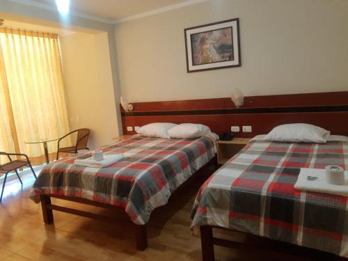 Postel nebo postele na pokoji v ubytování HOSTAL REAL CERRILLOS