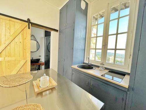 A kitchen or kitchenette at DOMFRONT-BNB : CHIC & CONFORT