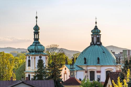 a church with two domes on top of buildings at Vila Heide in Česká Kamenice
