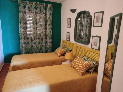 En eller flere senge i et værelse på Appartamento Martina2