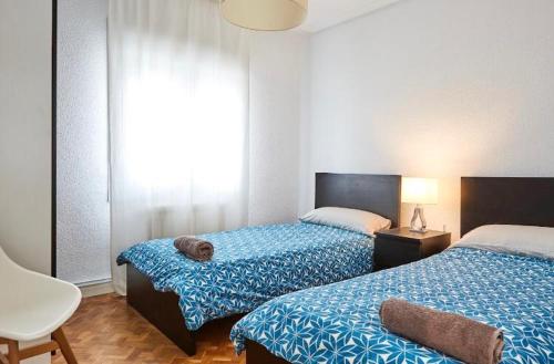 Postel nebo postele na pokoji v ubytování Apartamento Pamplona