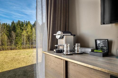 a room with a window looking out at a field at Lily Country Club in Klofta