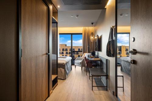 a hotel room with a view of a bedroom at Lily Country Club in Klofta