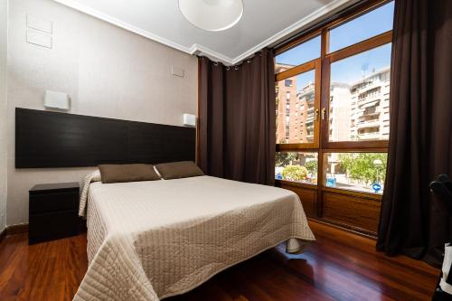 Postel nebo postele na pokoji v ubytování Alojamientos Rooms Catamarán