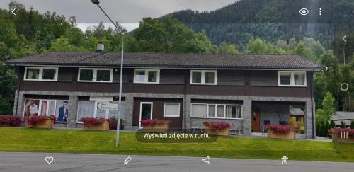 a house on the side of a street at Dalen Studio 1 in Dalen