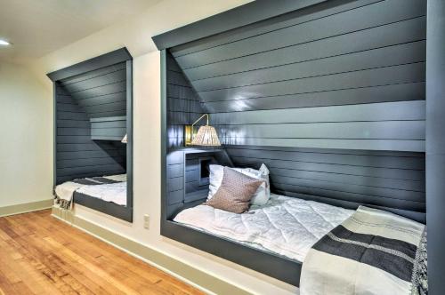 a bedroom with a large mirror in the wall at Peaceful and Elegant Cottage with Riverside View in Oregon City