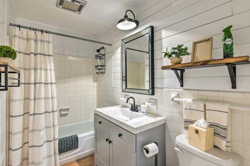 a bathroom with a sink and a mirror at Stylish Franklin Cabin on 6 Private Acres! in Franklin