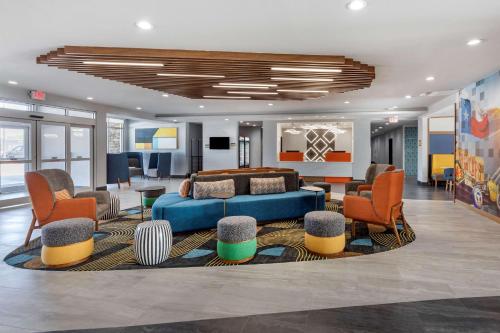 a hotel lobby with a blue couch and chairs at Best Western Plus Amarillo East Hotel in Amarillo