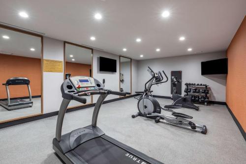 a gym with a treadmill and two exercise bikes at Best Western Plus Amarillo East Hotel in Amarillo