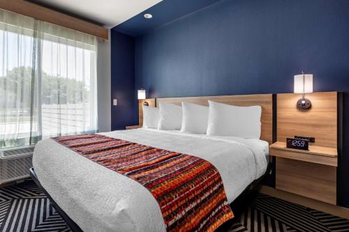 a hotel room with a bed and a large window at Best Western Plus Amarillo East Hotel in Amarillo