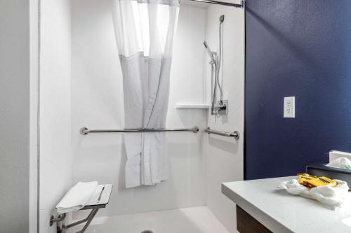 a bathroom with a shower with a glass door at Best Western Plus Amarillo East Hotel in Amarillo