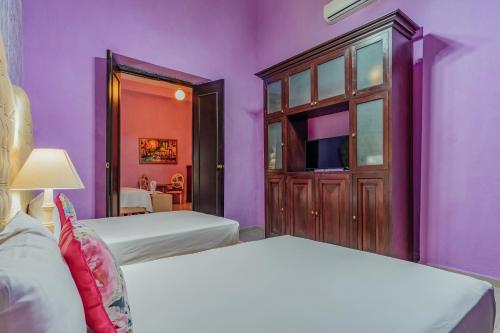 Кровать или кровати в номере Hotel Lavanda CAS Merida