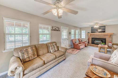 a living room with a couch and a fireplace at Musick Creek Landing in Shaver Lake