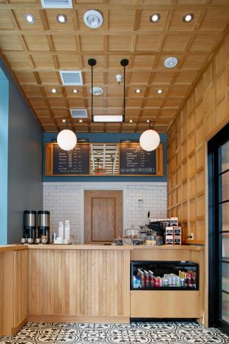 a fast food restaurant with a counter and lights at The Drayton Hotel Savannah, Curio Collection by Hilton in Savannah