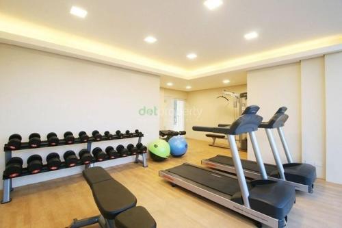 The fitness centre and/or fitness facilities at Downtown Davao City 2 BR Condo with pool and gym