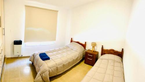 Ένα ή περισσότερα κρεβάτια σε δωμάτιο στο Alquiler de casa por día