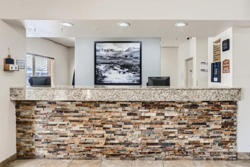 a brick wall with a picture on top of it at Baymont by Wyndham Loveland - Fort Collins Area in Loveland