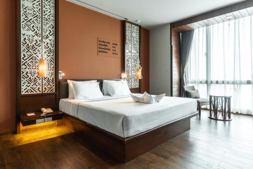 Ένα ή περισσότερα κρεβάτια σε δωμάτιο στο Grand Hotel Vientiane
