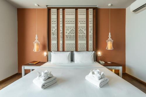 Ένα ή περισσότερα κρεβάτια σε δωμάτιο στο Grand Hotel Vientiane