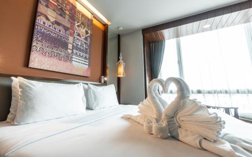 Ένα ή περισσότερα κρεβάτια σε δωμάτιο στο Grand Hotel Vientiane