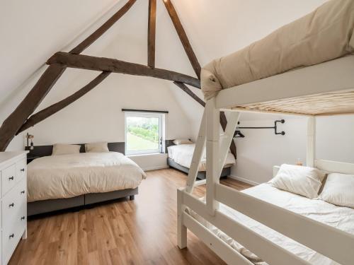 Tempat tidur dalam kamar di Lovely holiday home in Mont de l Enclus with garden