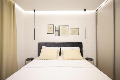 Un pat sau paturi într-o cameră la Olive Residence
