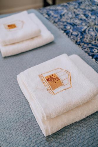 two white towels sitting on top of a table at Szumiące Trawy - Bory Tucholskie in Tleń