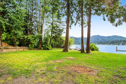 a park with trees and a body of water at Silver King in Bellingham