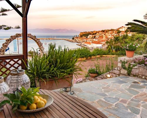a patio with a view of the ocean at Pelagia Apartments in Koroni