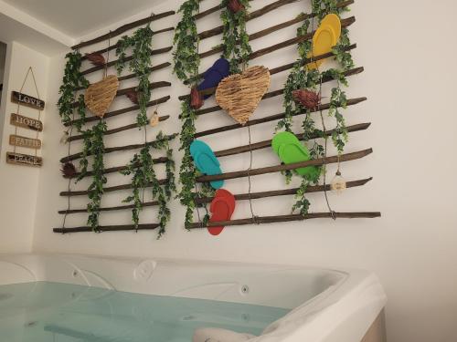 a bathroom with a bath tub and some plants at Suite & SPA Just Dream 28 in Six-Fours-les-Plages