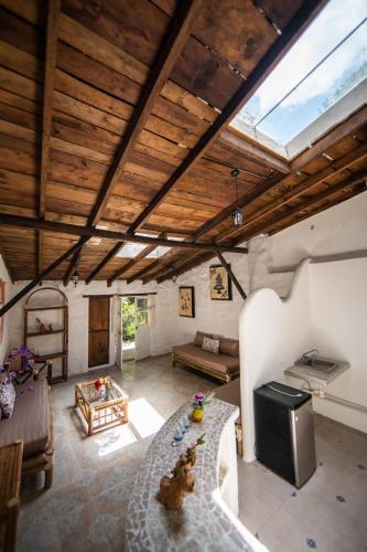 a large living room with a table and a couch at Hotel Hacienda San Bartolo in Xico