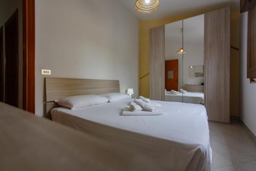 A bed or beds in a room at SanvitoTour - Appartamenti Tajine